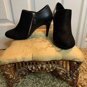 Black booties with golden zipper